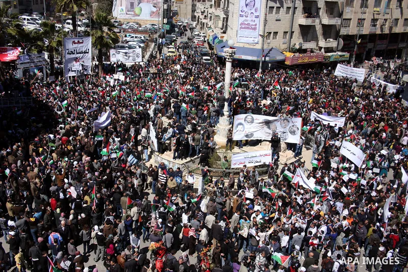Palestinian demonstrators take part in a protest calling for Palestinian political unity between Gaza's Hamas rulers and the Fatah-dominated Palestinian Authority which rules from Ramallah, on March 15, 2011 in Ramallah,...