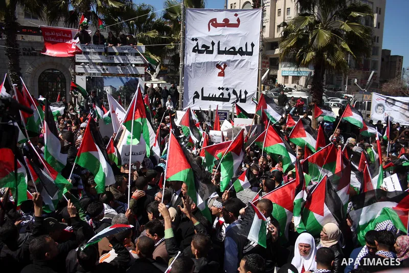 Palestinian demonstrators take part in a protest calling for Palestinian political unity between Gaza's Hamas rulers and the Fatah-dominated Palestinian Authority which rules from Ramallah, on March 15, 2011 in Ramallah,...