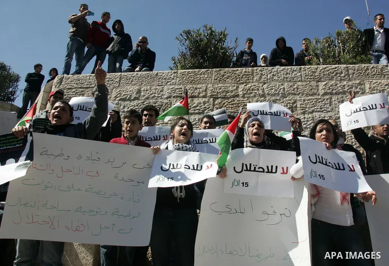 Palestinian demonstrators take part in a protest calling for Palestinian political unity between Gaza's Hamas rulers and the Fatah-dominated Palestinian Authority which rules from Ramallah, on March 15, 2011 in front of...