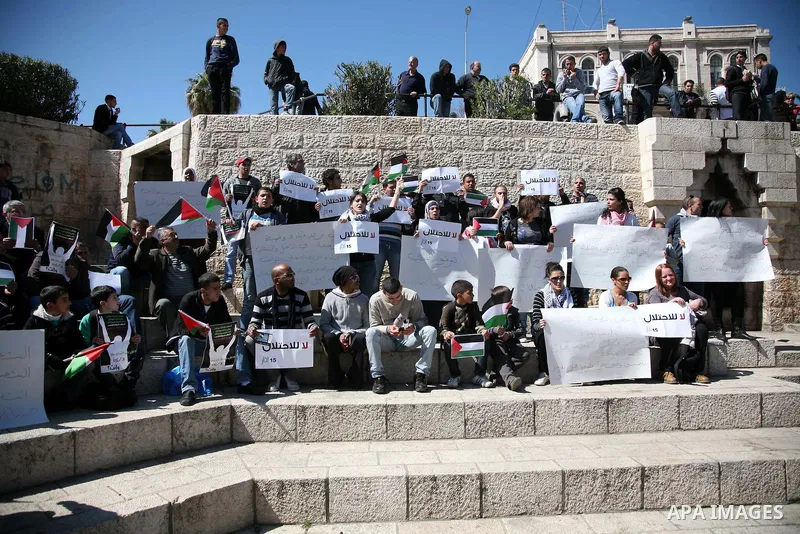 Palestinian demonstrators take part in a protest calling for Palestinian political unity between Gaza's Hamas rulers and the Fatah-dominated Palestinian Authority which rules from Ramallah, on March 15, 2011 in front of...