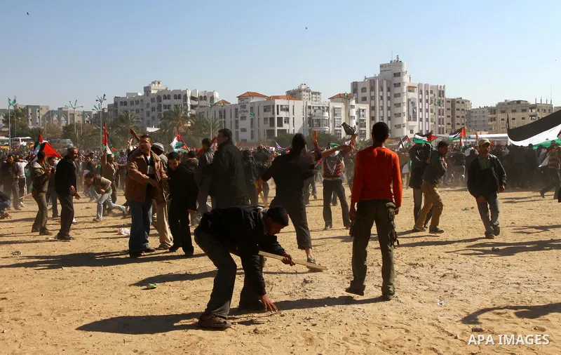 Palestinian demonstrators run during brief clashes between Hamas supporters and protestors supporting other Palestinian factions, during a rally calling for Palestinian political unity between Gaza's Hamas rulers and the...