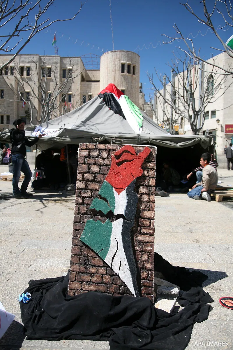 Palestinian students camping in the courtyard of the Nativity in Bethlehem, calling for national Palestinian reconciliation on17 March 2011.Photo by Sliman Khader..