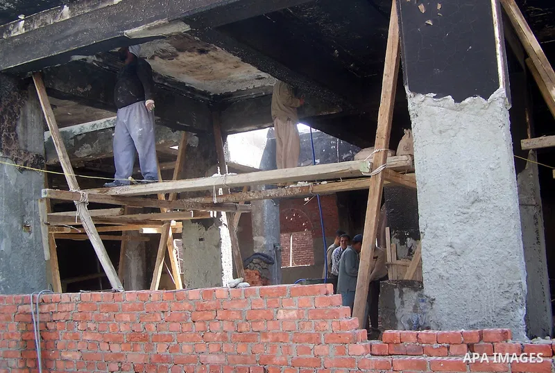 Egyptian workers take part in the rebuilding of a church in the village of Soul, south of Cairo, Egypt, Thuresday, March 17, 2011. The Egyptian army started the rebuilding of a church in Soul that was torched by a Muslim...