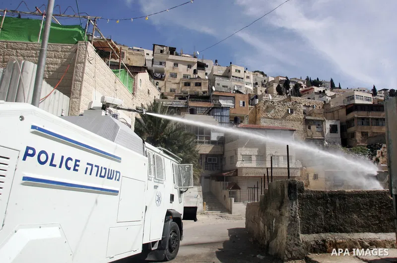 Israeli soldiers fire tear gas canisters towards Palestinian demonstrators during the clashes after Friday prayers in Jerusalem's neighbourhood of silwan on March 18, 2011. Photo by Mahfouz Abu Turk