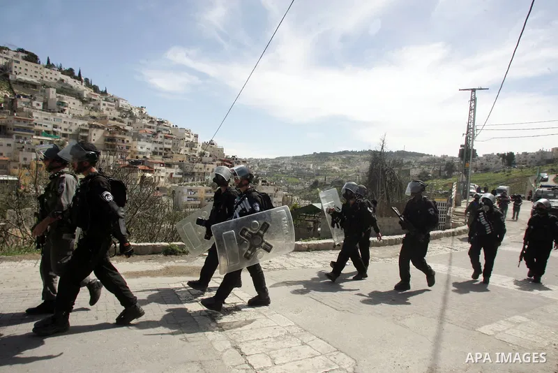 Israeli soldiers fire tear gas canisters towards Palestinian demonstrators during the clashes after Friday prayers in Jerusalem's neighbourhood of silwan on March 18, 2011. Photo by Mahfouz Abu Turk