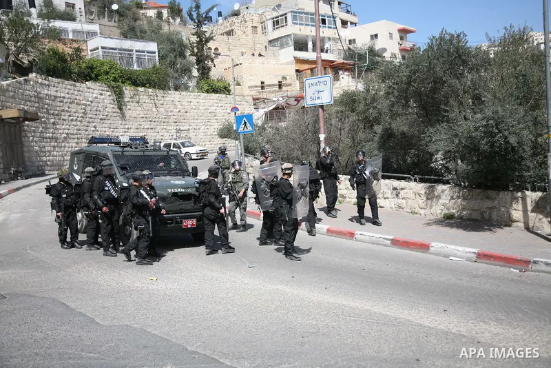 Israeli soldiers fire tear gas canisters towards Palestinian demonstrators during the clashes after Friday prayers in Jerusalem's neighbourhood of silwan on March 18, 2011. Photo by Sliman Khader