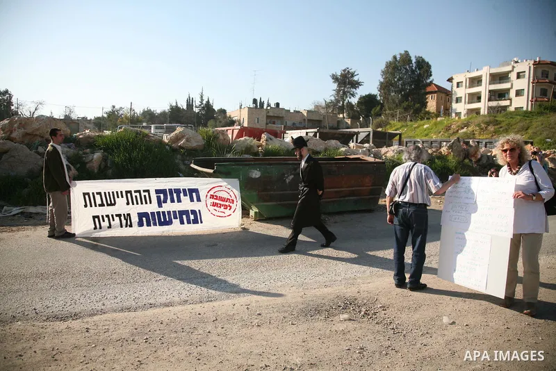 Palestinians and foreign activists take part in the weekly demonstration in the neighborhood of Sheikh Jarrah in East Jerusalem on March 18, 2011. Photo by Sliman Khader