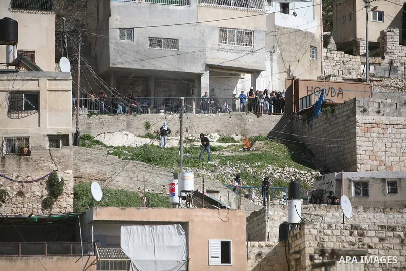Israeli soldiers fire tear gas canisters towards Palestinian demonstrators during the clashes after Friday prayers in Jerusalem's neighbourhood of silwan on March 18, 2011. Photo by Sliman Khader