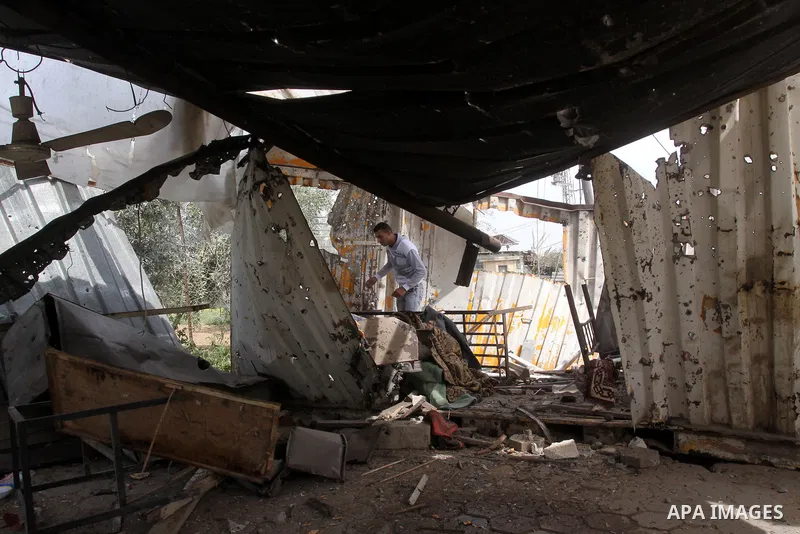 Palestinian looks at the damage after Israeli strikes on the Gaza Strip. Israeli strikes on the Gaza Strip wounded five Hamas security officers and a boy on Saturday after militants launched mortar bombs into Israel, lig...