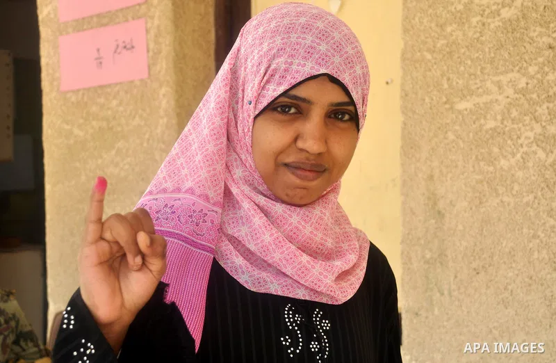 Egyptian show their inked fingers after voting for the referendum on constitutional amendments in Cairo, capital of Egypt. Egyptians started voting on Saturday morning to decide on constitutional amendments aimed at ensu...