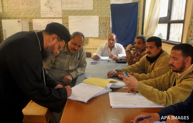 Egyptians cast their vote during a national referendum, at a school in Cairo. Egyptians flocked to the polls on Saturday in a historic referendum on changes to the constitution. The amendments were proposed by a judicial...