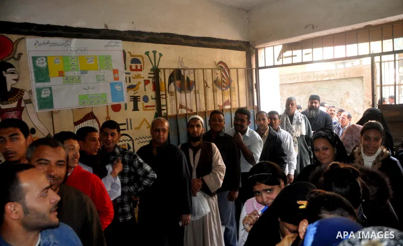 Egyptians queue to cast their vote during a national referendum, at a school in Cairo. Egyptians flocked to the polls on Saturday in a historic referendum on changes to the constitution. The amendments were proposed by a...