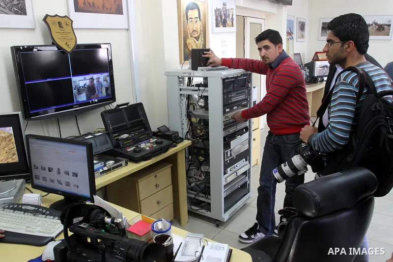 Palestinian journalists inspect the damages at Reuters office after Palestinian security forces raid the office in Gaza City on March 19,2011. Photo by Mohammed Asad