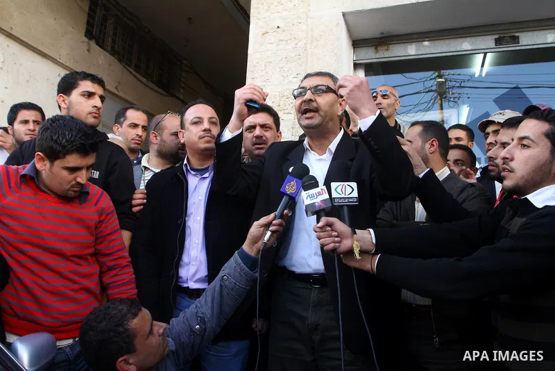Palestinian journalists take part in a protest against the Palestinian security forces after they raid on the Reuters office in Gaza City on March 19,2011. Photo by Ashraf Amra