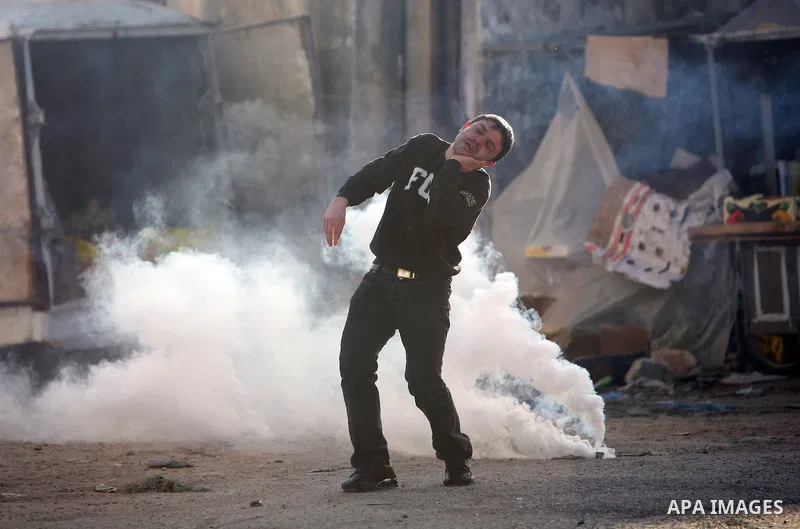 Israeli Border Police fire tear gas towards Palestinian stone throwers during a clash in the Shuafat Refugee Camp, north of Jerusalem, in the West Bank, 19 March 2011. Palestinians clashed with Israeli forces in several...