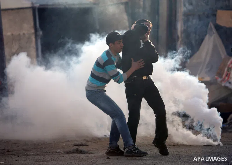 Israeli Border Police fire tear gas towards Palestinian stone throwers during a clash in the Shuafat Refugee Camp, north of Jerusalem, in the West Bank, 19 March 2011. Palestinians clashed with Israeli forces in several...