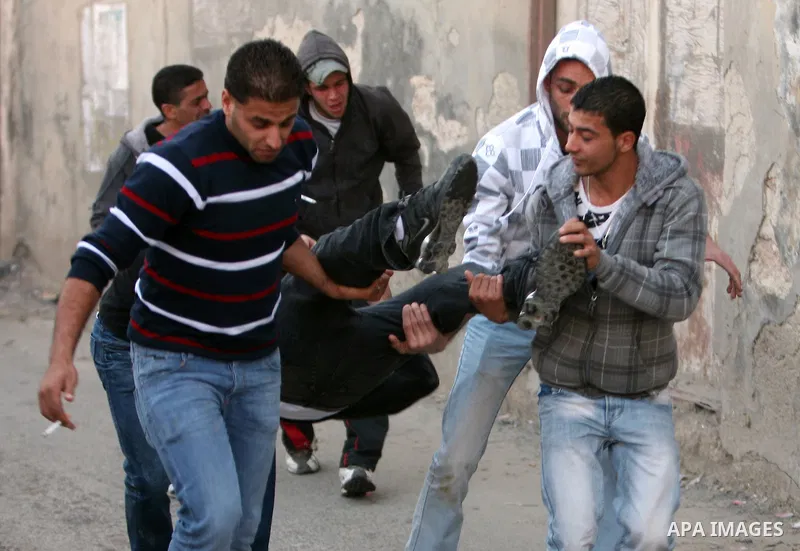 Israeli Border Police fire tear gas towards Palestinian stone throwers during a clash in the Shuafat Refugee Camp, north of Jerusalem, in the West Bank, 19 March 2011. Palestinians clashed with Israeli forces in several...