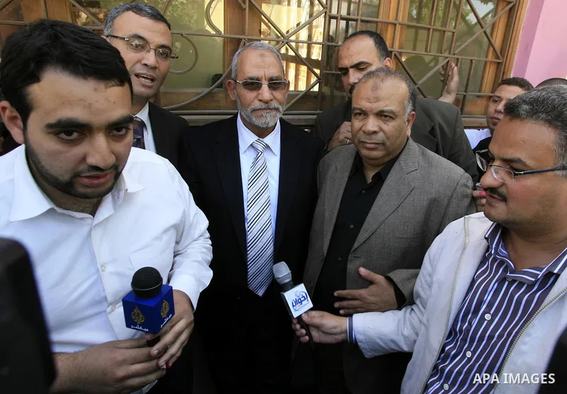 Mohammed Badie, the head of Egypt's Muslim Brotherhood speaks to the press outside a polling station Cairo after casting his vote on March 19, 2011 as voters got their first taste of democracy in a referendum to a packag...