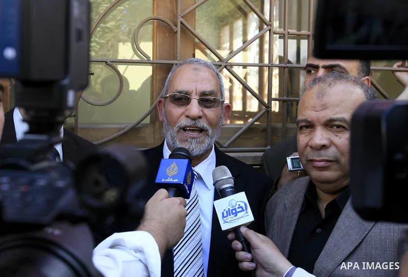 Mohammed Badie, the head of Egypt's Muslim Brotherhood speaks to the press outside a polling station Cairo after casting his vote on March 19, 2011 as voters got their first taste of democracy in a referendum to a packag...