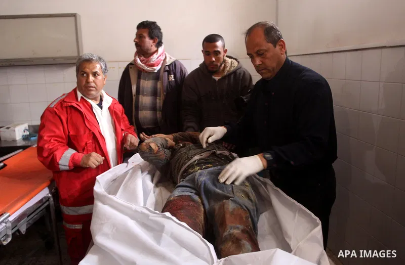 Relatives of Gazsem abu Etwee, 17-years-old and Imad Frajallah also 17, are brought to the morgue at a hospital in Gaza City on March 20, 2011. Palestinian medical officials said they had found the bodies of two men sout...