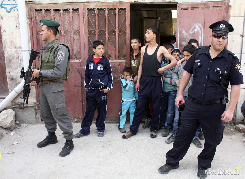Israelis parade during their celebration of the Jewish holiday of Purim in the divided West Bank city of Hebron, on 20 March 2011. The joyful Jewish holiday of Purim celebrates the Jews' salvation from genocide in ancien...