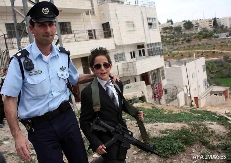 Israelis parade during their celebration of the Jewish holiday of Purim in the divided West Bank city of Hebron, on 20 March 2011. The joyful Jewish holiday of Purim celebrates the Jews' salvation from genocide in ancien...