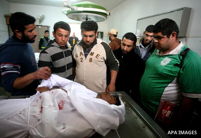 Relatives of Gazsem abu Etwee, 17-years-old and Imad Frajallah also 17, are brought to the morgue at a hospital in Gaza City on March 20, 2011. Palestinian medical officials said they had found the bodies of two men sout...