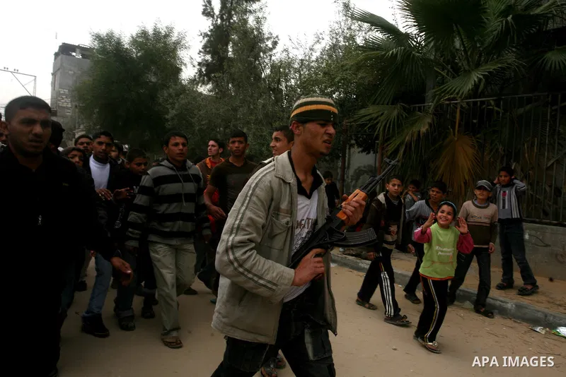 Palestinians, relatives of Emad Faragallah, mourn during his funeral in Nusairat refugee camp in the central Gaza Strip March 20, 2011. Two Palestinians, including Faragallah were killed by Israeli gunfire on Saturday ne...