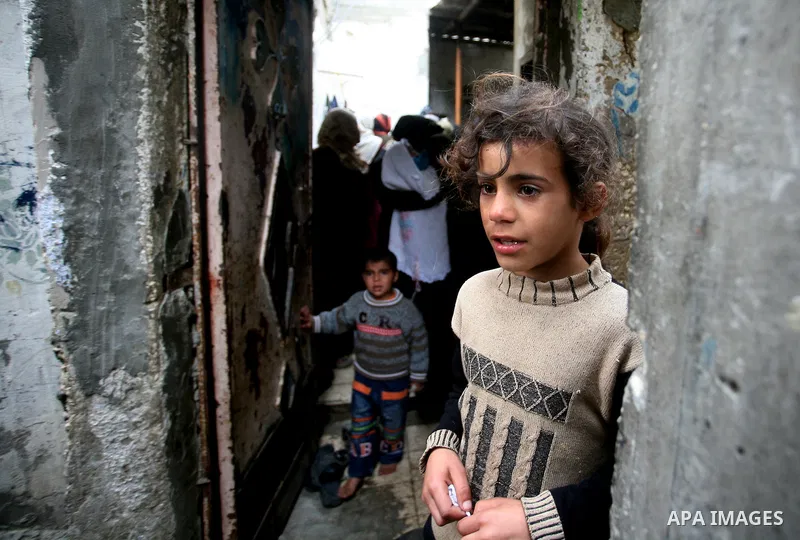 Palestinians, relatives of Emad Faragallah, mourn during his funeral in Nusairat refugee camp in the central Gaza Strip March 20, 2011. Two Palestinians, including Faragallah were killed by Israeli gunfire on Saturday ne...