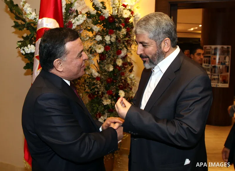 The head of the Hamas political bureau, Khaled Mashaal meets with the Tunisian ambassador in Syria, Mohammed Ouati in Damascus on March 20,2011. Photo by Majd Majd
