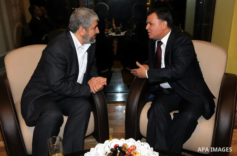 The head of the Hamas political bureau, Khaled Mashaal meets with the Tunisian ambassador in Syria, Mohammed Ouati in Damascus on March 20,2011. Photo by Majd Majd