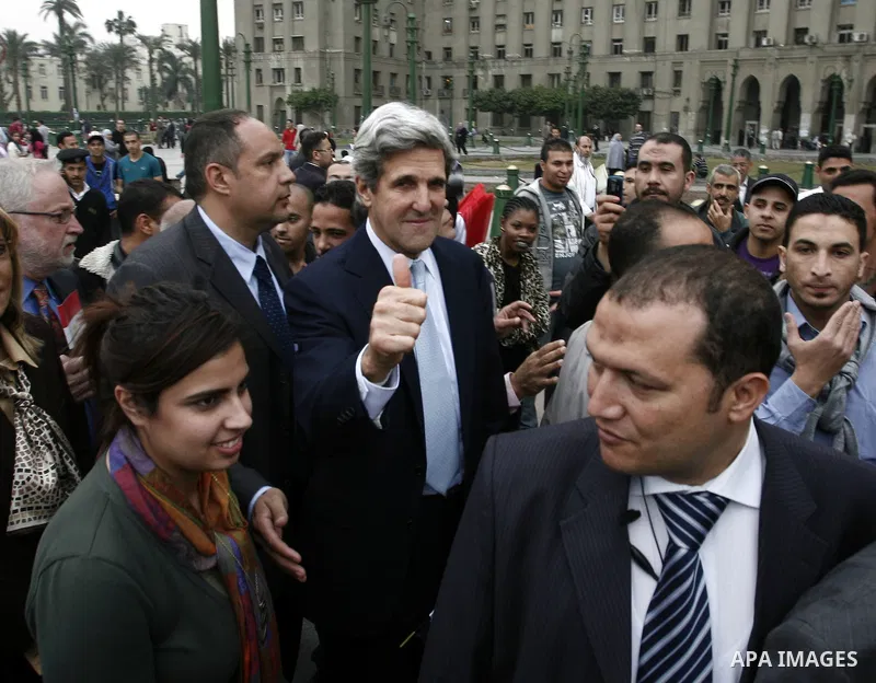 US senator John Kerry greets Egyptians as he visits Tahrir Square, the focal point of Egyptian uprising, in Cairo, Egypt, Sunday, March 20, 2011. Kerry hold talks with Egypt's military rulers, the Supreme Council of the...