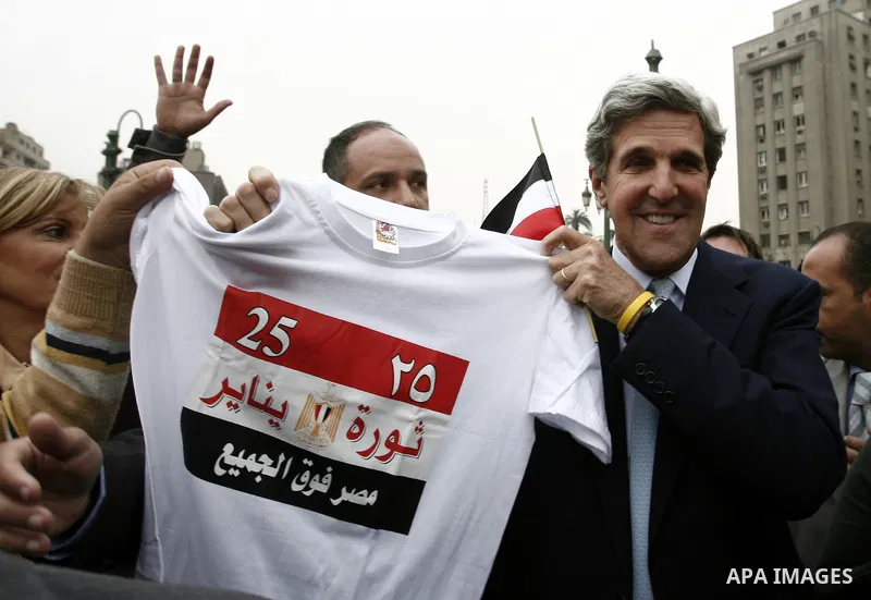 US senator John Kerry greets Egyptians as he visits Tahrir Square, the focal point of Egyptian uprising, in Cairo, Egypt, Sunday, March 20, 2011. Kerry hold talks with Egypt's military rulers, the Supreme Council of the...