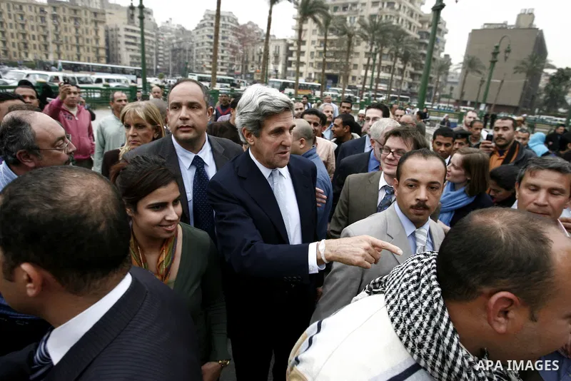 US senator John Kerry greets Egyptians as he visits Tahrir Square, the focal point of Egyptian uprising, in Cairo, Egypt, Sunday, March 20, 2011. Kerry hold talks with Egypt's military rulers, the Supreme Council of the...