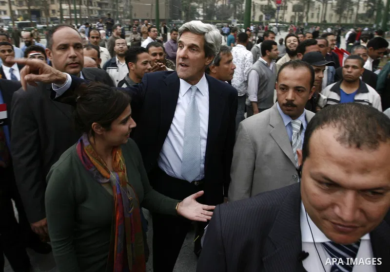 US senator John Kerry greets Egyptians as he visits Tahrir Square, the focal point of Egyptian uprising, in Cairo, Egypt, Sunday, March 20, 2011. Kerry hold talks with Egypt's military rulers, the Supreme Council of the...