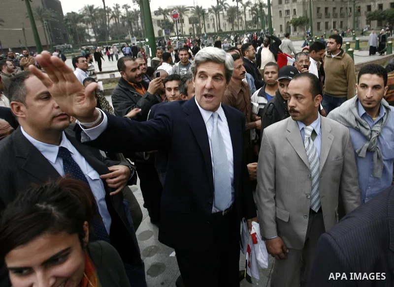 US senator John Kerry greets Egyptians as he visits Tahrir Square, the focal point of Egyptian uprising, in Cairo, Egypt, Sunday, March 20, 2011. Kerry hold talks with Egypt's military rulers, the Supreme Council of the...