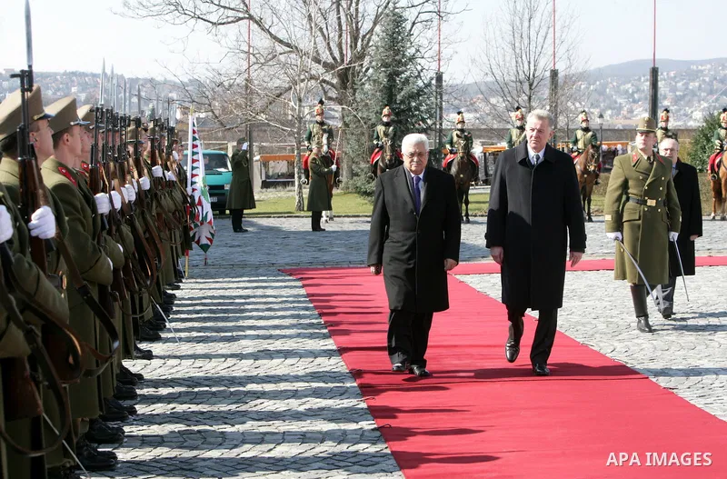 Palestinian President Mahmoud Abbas and Hungarian President Pal Schmitt review an honour guard in front of the presidental palace in Budapest on March 21, 20011 during a welcoming ceremony. The Palestinian National Counc...