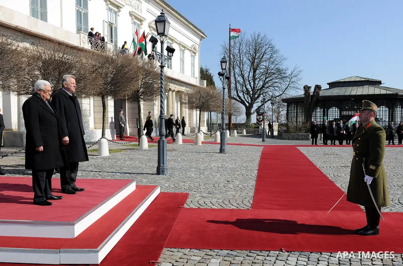 Palestinian President Mahmoud Abbas and Hungarian President Pal Schmitt review an honour guard in front of the presidental palace in Budapest on March 21, 20011 during a welcoming ceremony. The Palestinian National Counc...