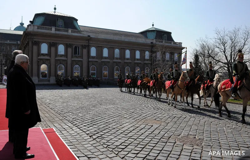 Palestinian President Mahmoud Abbas and Hungarian President Pal Schmitt review an honour guard in front of the presidental palace in Budapest on March 21, 20011 during a welcoming ceremony. The Palestinian National Counc...