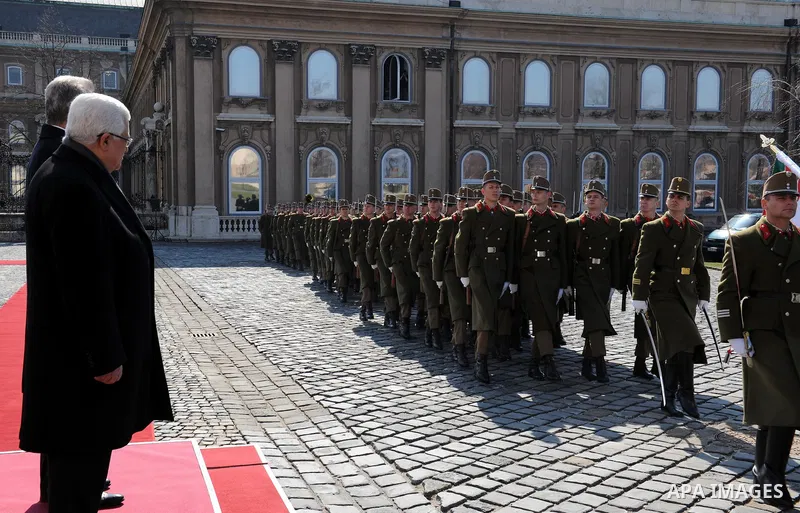 Palestinian President Mahmoud Abbas and Hungarian President Pal Schmitt review an honour guard in front of the presidental palace in Budapest on March 21, 20011 during a welcoming ceremony. The Palestinian National Counc...