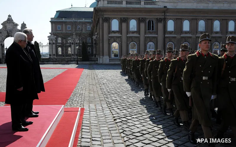 Palestinian President Mahmoud Abbas and Hungarian President Pal Schmitt review an honour guard in front of the presidental palace in Budapest on March 21, 20011 during a welcoming ceremony. The Palestinian National Counc...