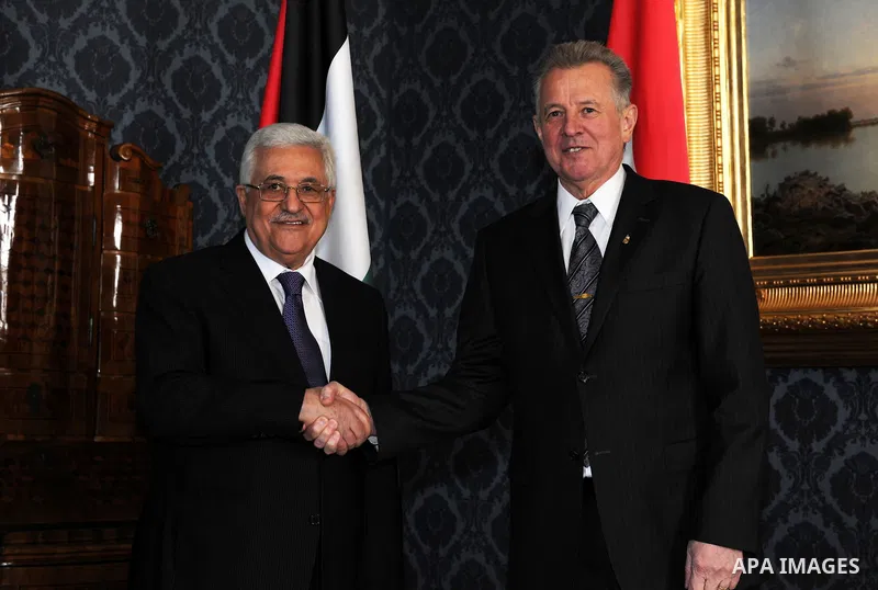 Palestinian President Mahmoud Abbas meets with the Hungarian President Pal Schmitt review an honour guard in front of the presidental palace in Budapest on March 21, 20011. The Palestinian National Council was saddened b...