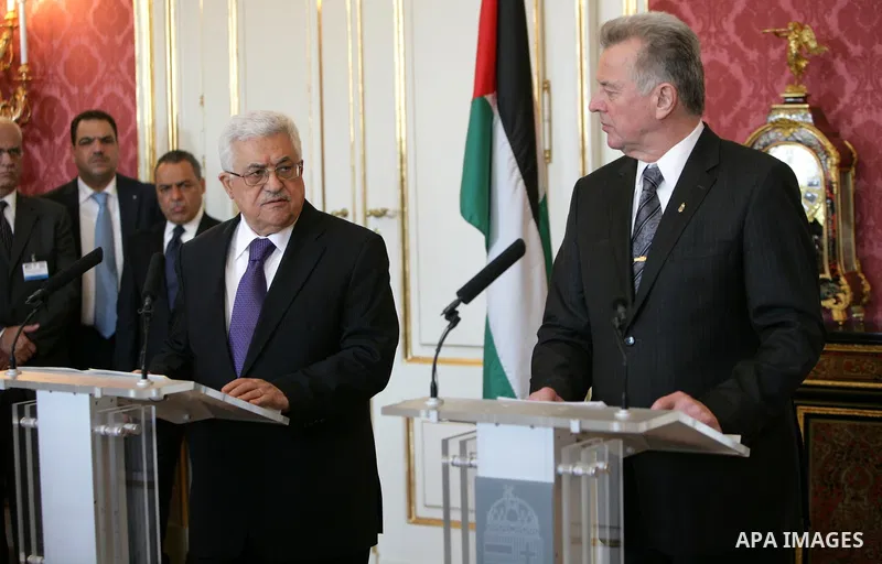 Palestinian President Mahmoud Abbas meets with the Hungarian President Pal Schmitt review an honour guard in front of the presidental palace in Budapest on March 21, 20011. The Palestinian National Council was saddened b...