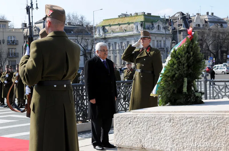 Palestinian President Mahmoud Abbas lays a wreath at the monument of the Unknown Soldier at Heroes Square in Budapest on March 21, 20011. The Palestinian National Council was saddened by the bloodshed in Libya's month-lo...