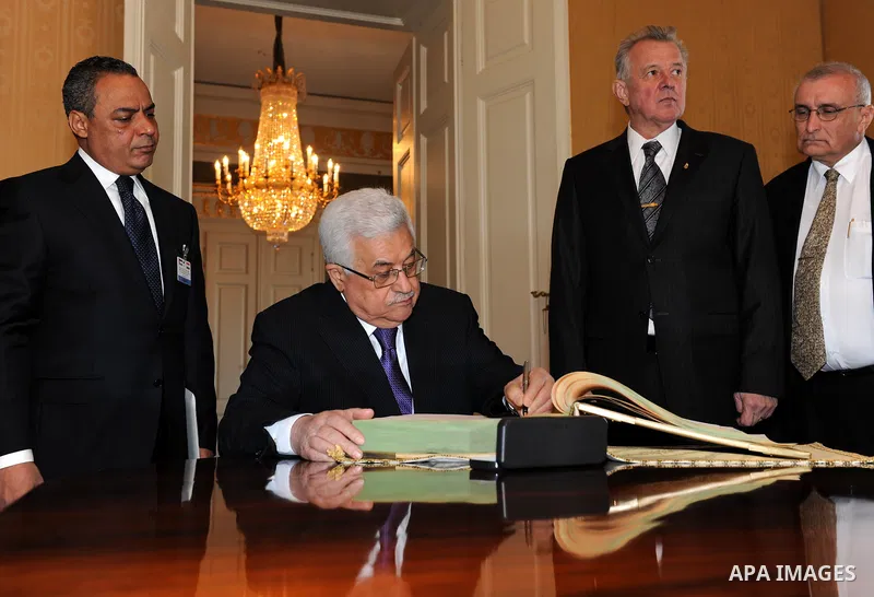 Palestinian President Mahmoud Abbas meets with the Hungarian President Pal Schmitt review an honour guard in front of the presidental palace in Budapest on March 21, 20011. The Palestinian National Council was saddened b...