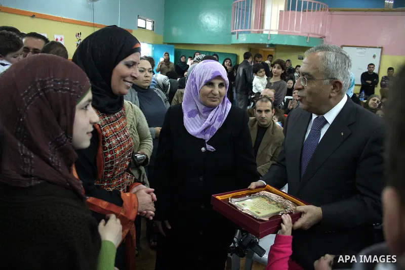 Palestinian Prime Minister Salam Fayyad participates in a celebration at "the happiness of Childhood Center" on the occasion of Mother Day in the West Bank city of Ramallah on March 21, 2011. Photo by Issam Rimawi