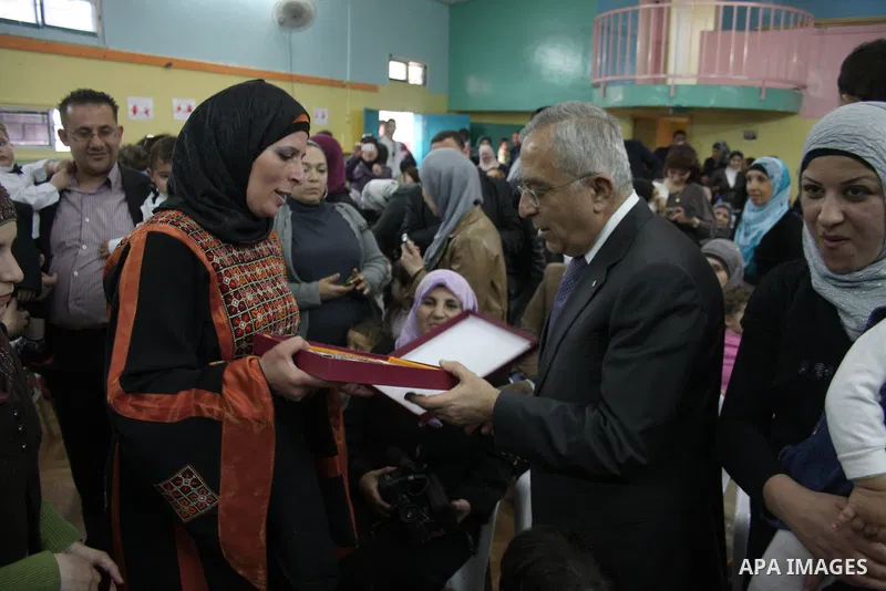 Palestinian Prime Minister Salam Fayyad participates in a celebration at "the happiness of Childhood Center" on the occasion of Mother Day in the West Bank city of Ramallah on March 21, 2011. Photo by Issam Rimawi