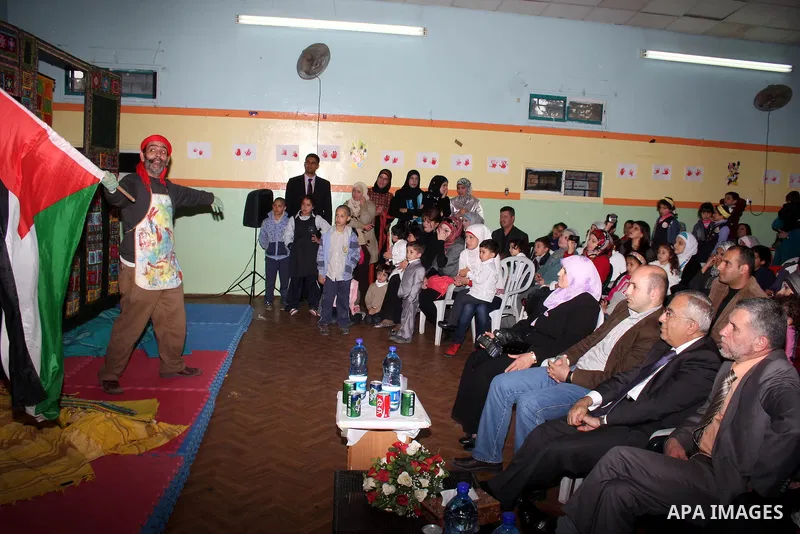 Palestinian Prime Minister Salam Fayyad participates in a celebration at "the happiness of Childhood Center" on the occasion of Mother Day in the West Bank city of Ramallah on March 21, 2011. Photo by Issam Rimawi