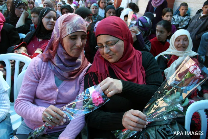 Palestinian women attend a celebration at Al-Walajah school on the occasion of Mother Day in Walajah village near the West Bank city of Bethlehem on March 21, 2011. Photo by Issam Rimawi