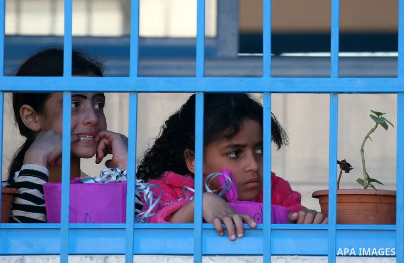 Palestinian women attend a celebration at Al-Walajah school on the occasion of Mother Day in Walajah village near the West Bank city of Bethlehem on March 21, 2011. Photo by Issam Rimawi